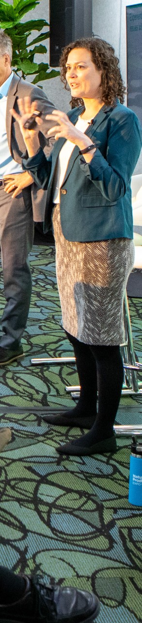 Expo floor with booths and industry professionals